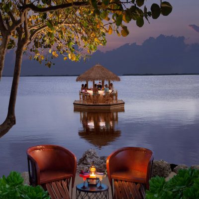 FloatingTikiBar floating tiki bar at night in the water