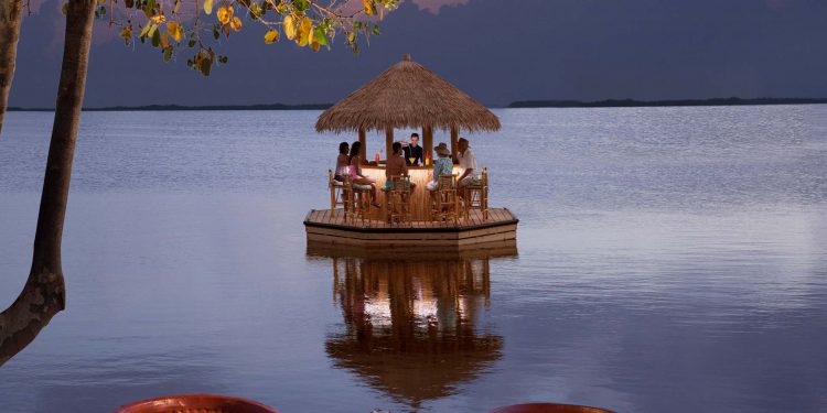FloatingTikiBar floating tiki bar at night in the water