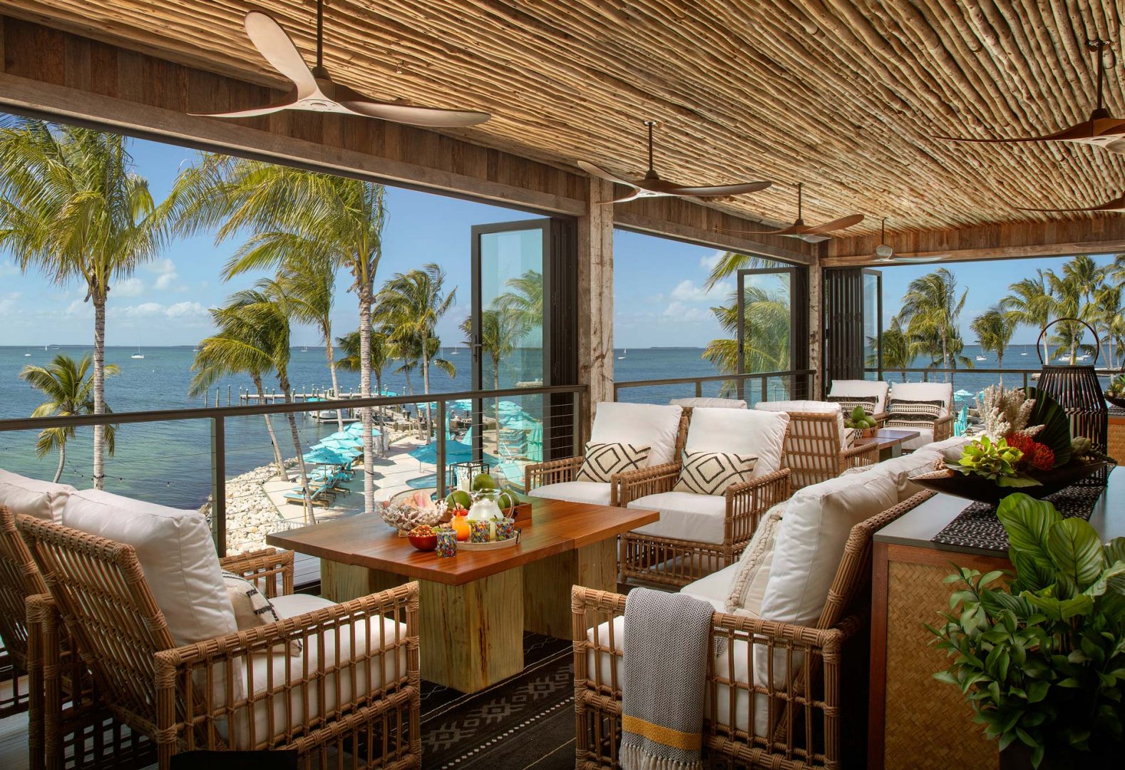 Bamboo-styled indoor lounge with water view