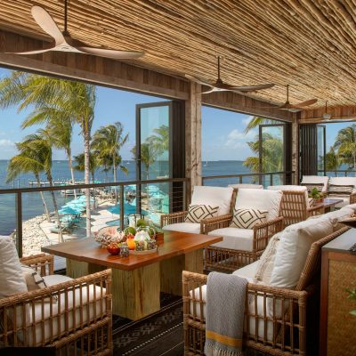 Bamboo-styled indoor lounge with water view