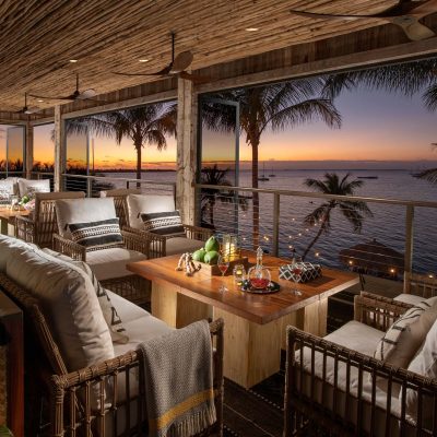 Bamboo-styled indoor lounge with water view