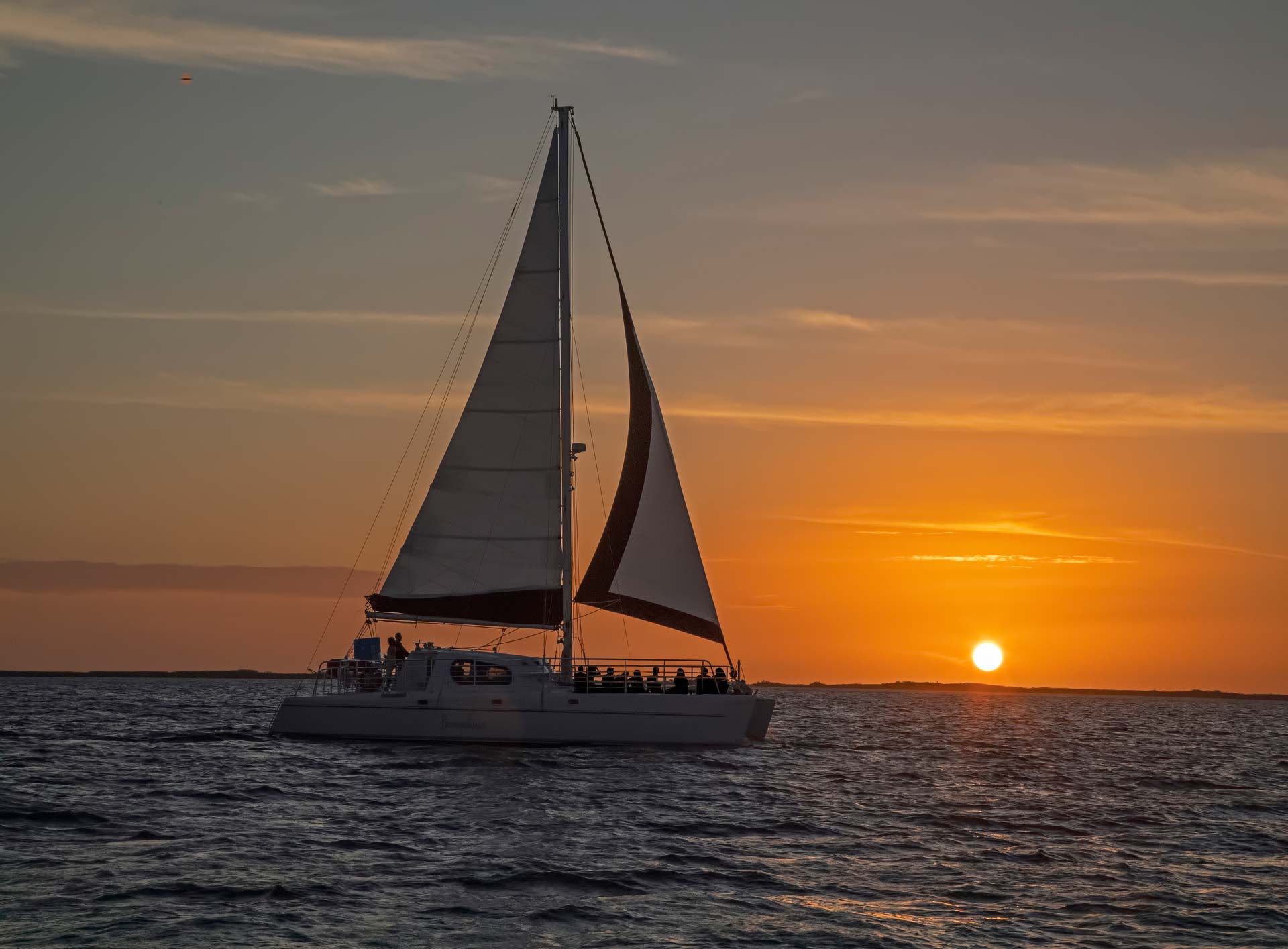 Lady B sailboat out on the open water at sunset