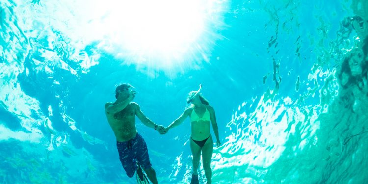 a couple snorkeling in the ocean