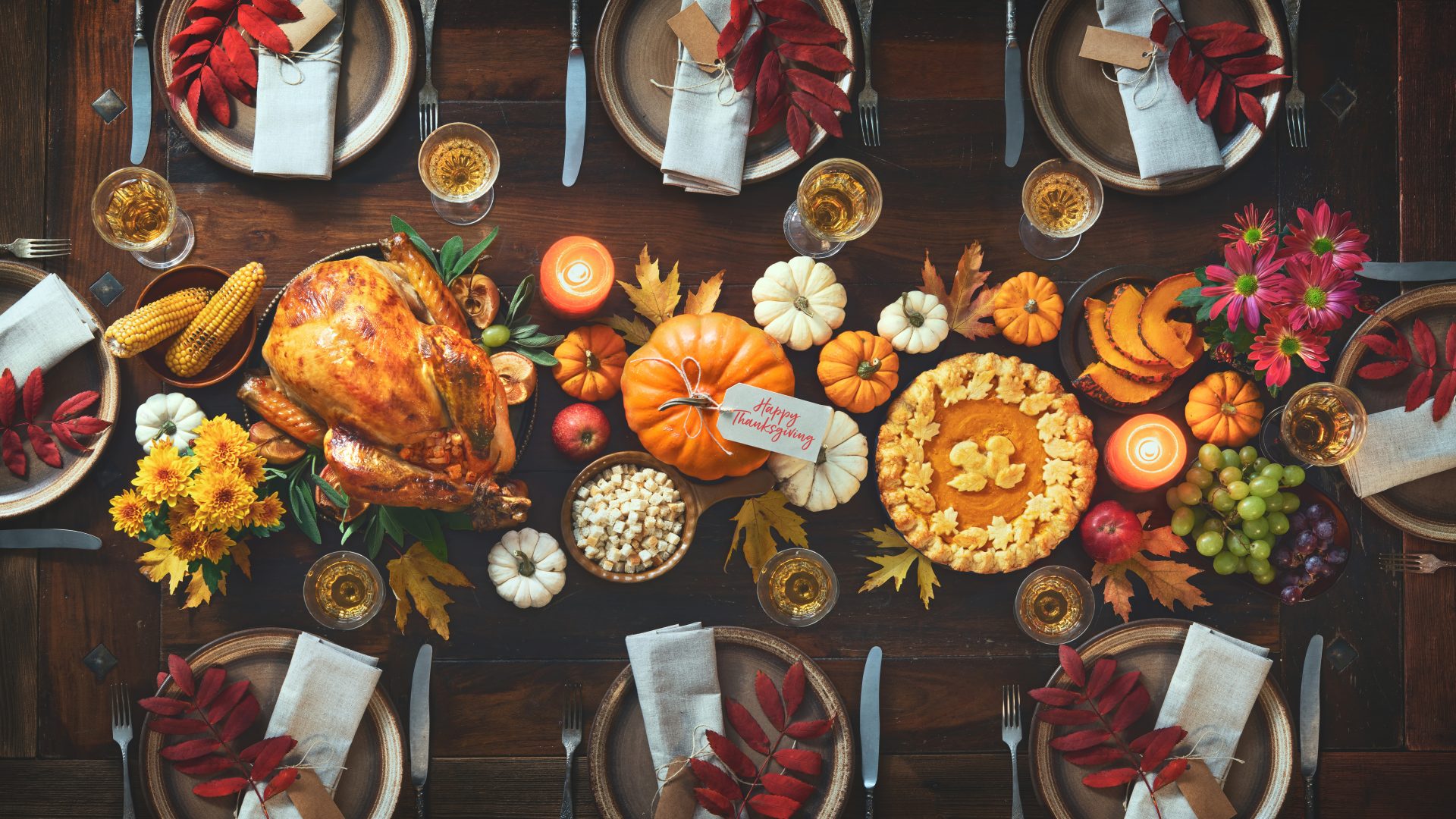 Thanksgiving dinner table settings with food